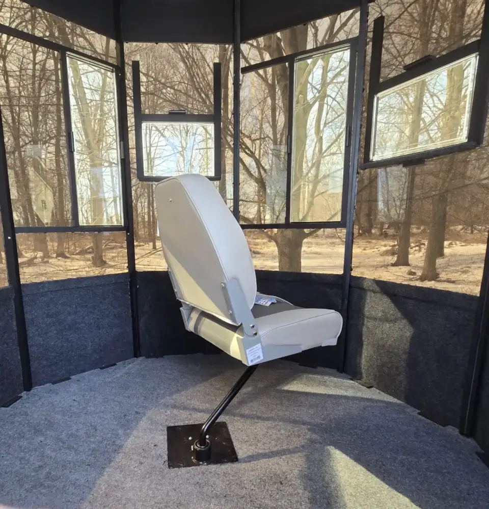 Buckeye blind hunting seat inside a Lifetime Manufacturing blind where you can see out through the walls of the blind